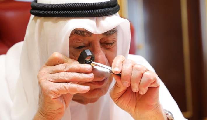 Alfardan Group — a jewellery craftsman examining a gem